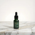 Bright Aura face serum bottle for enhancing skin radiance and even-looking complexion